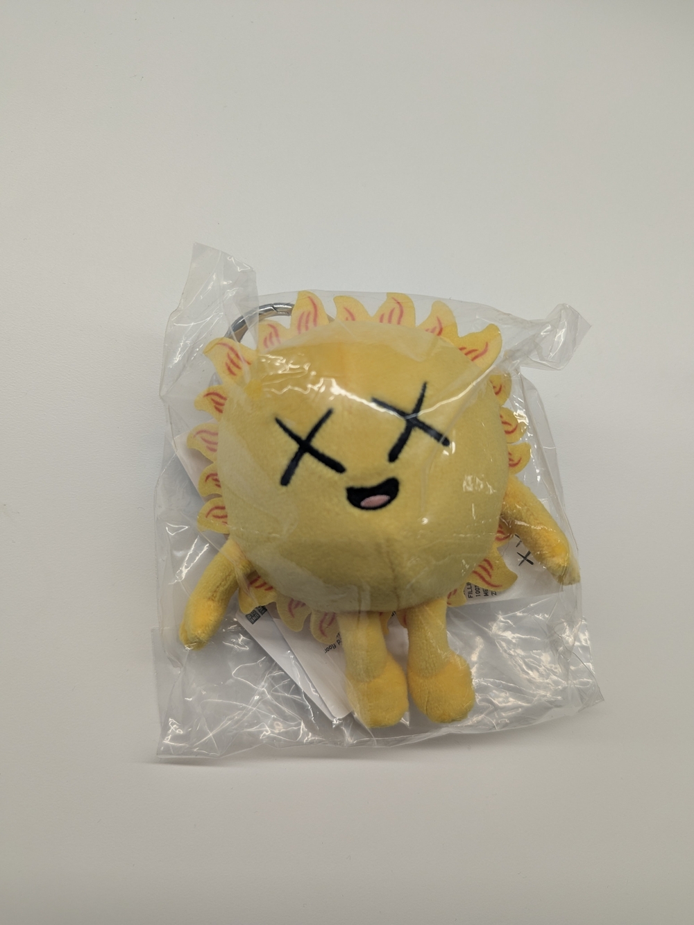Uniqlo KAWS Universe Sun Plush Keychain